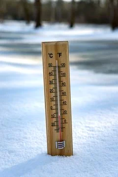 Thermometer on snow Stock Photos