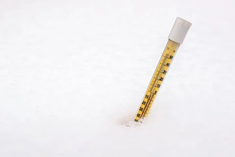 Thermometer in the snow Stock Photos