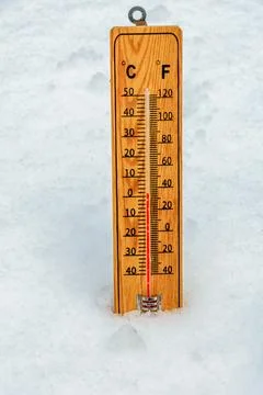 Thermometer in snow Stock Photos