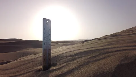 A Thermometer Is Stuck In The Hot Sand of a Dune Against a Burning Sun. Stock Footage 264801706