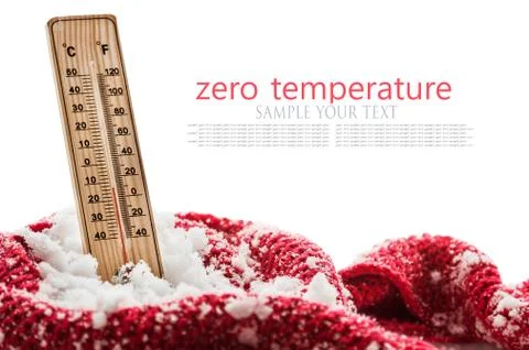 Thermometer with sub zero temperature sticks out in a snowdrift wrapped red Stock Photos