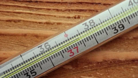 The thermometer is on the table. Heat. Covid 19. Stock Footage 153226480