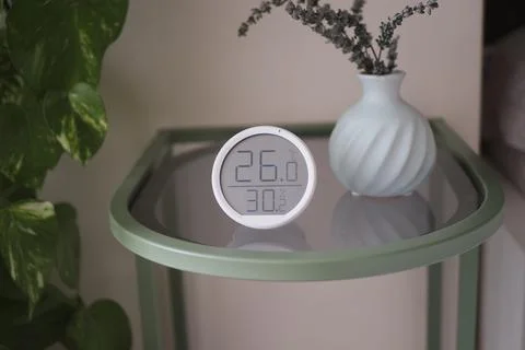 Thermometer on table showing temp and humidity Stock Photos