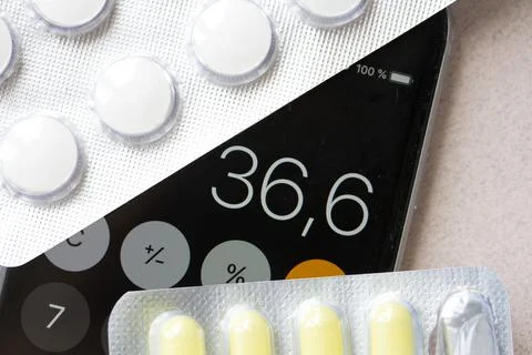 Thermometer, temperature 36.6 and tablets Stock Photos