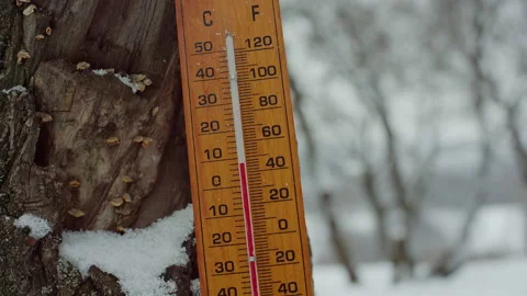 Thermometer temperature below zero cold winter meteorology celsius fahrenheit Stock Footage