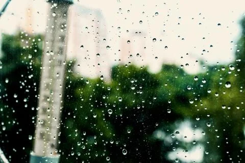 The thermometer on the of the window, the rain poured. Stock Photos