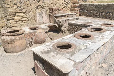 Thermopolium or Taberna (cook-shop) in Ercolano - Herculaneum, ancient Roman Stock Photos