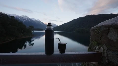 Thermos and Mate Cup Overlooking Lake in Patagonia at Sunset Stock Footage 334665448