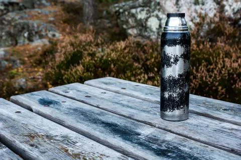 Thermos on table Stock Photos