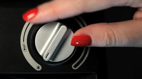 Thermostat adjusting with man hand Stock Footage 24825564
