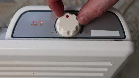 Thermostat dial of convector heater turns to maximum temperature setting. Video stock 234920466