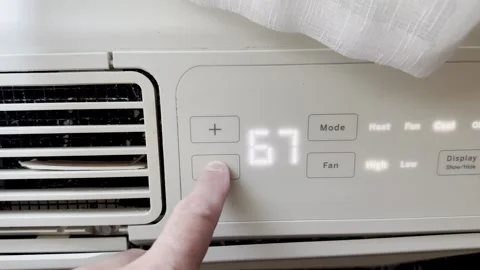Thermostat Display Screen Set To 67 Degrees Cool Stock Footage 338311456