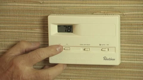 Thermostat lowering temperature Stock Footage 8682080