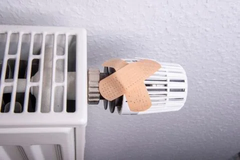 Thermostat with plaster to avoid heating costs Stock Photos