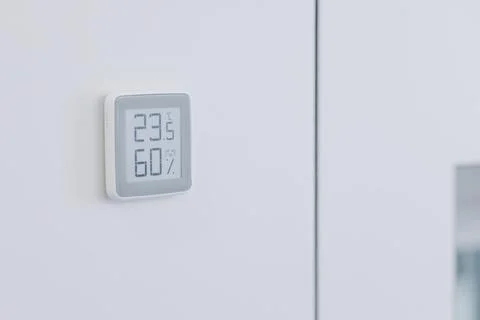 Thermostat programmable for a warm floor on the wall. Stock Photos