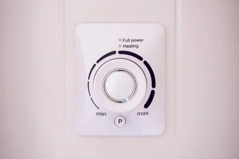 Thermostat temperature control unit white. boiler heating switch Stock Photos