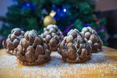 These chocolate pine cone-shaped shortbread cookies with sweet snow. Stock Photos