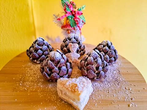 These chocolate pine cone-shaped shortbread cookies with cookie Heart,sweet snow Stock Photos