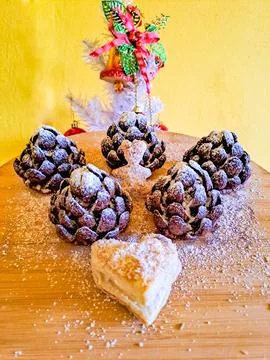 These chocolate pine cone-shaped shortbread cookies with cookie Heart,sweet snow Stock Photos