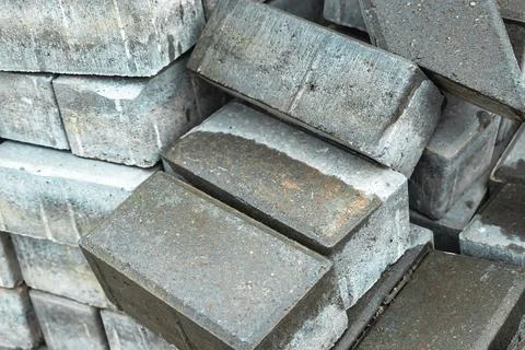These robust concrete bricks are stacked neatly at a building site, prepared  Photos