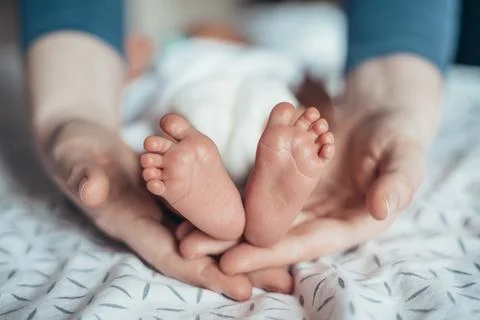 These tiny feet need guidance Stock Photos