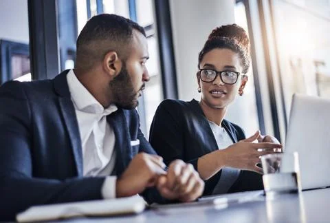 They always develop the best ideas together. two businesspeople working together Stock Photos