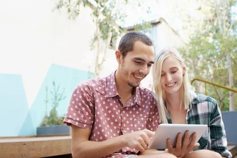 They brought technology with on their date Stock Photos