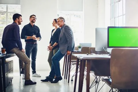 They enjoy the creative process. a group of designers having a discussion at 写真素材