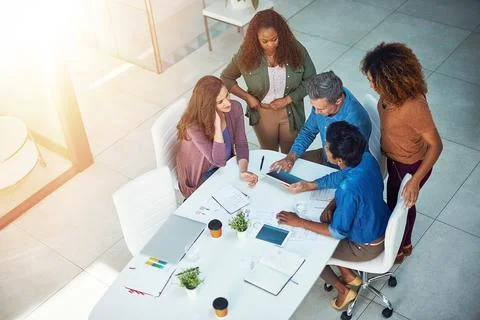 They have a solution for all your creative needs. a group of designers gathering Stock Photos