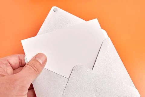 They hold an envelope with a white sheet in their hands. Banner for adverti.. Stock Photos