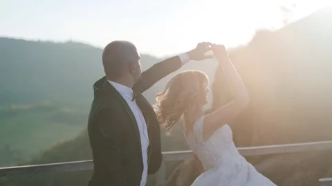 They hugging each other and feeling romantic together background cliff and rocks Stock Footage 221017118