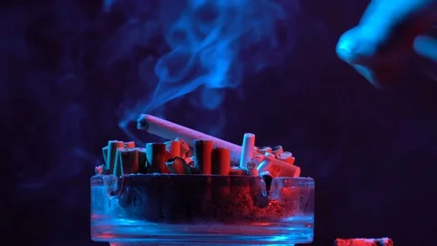 They put a cigarette in the ashes Video stock 75120981