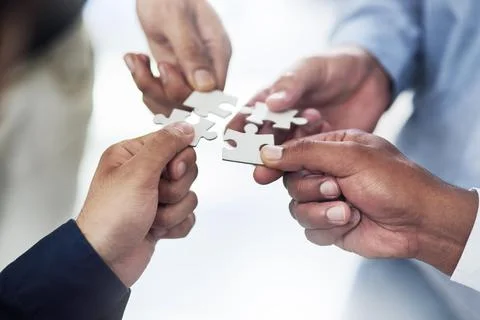 They solve problems piece by piece. High angle shot of a group of unidentifiable Stock Photos