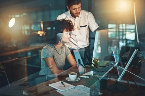 They work around the clock to satisfy their clients. Shot of colleagues working Stock Photos