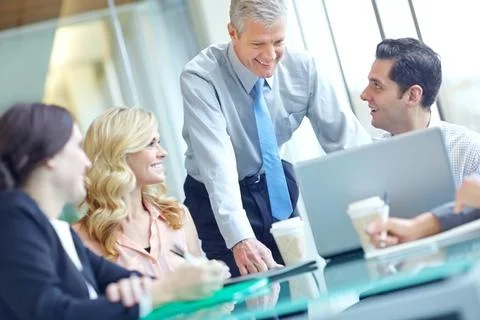 Theyre all on the same page. a group of businesspeople having a meeting while Foto stock