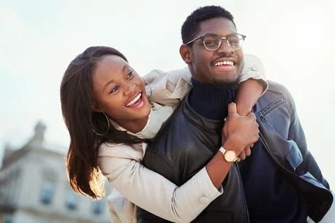 Theyre inseparable. an affectionate young couple bonding together outdoors. Stock Photos