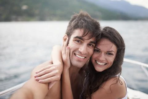 Theyre inseparable. Portrait of an affectionate young couple enjoying a boat Stock Photos