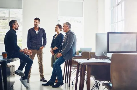 Theyre in a problem-solving state of mind. a group of designers having a Foto stock