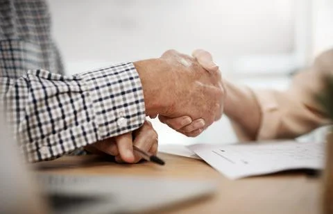 Theyre on the same page. an unrecognizable senior couple shaking hands while Stock Photos
