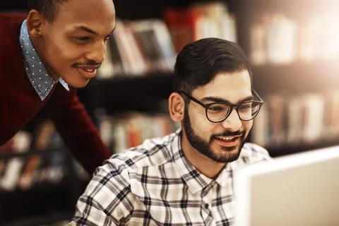 Theyve partnered up on their next assignment. two university students working Foto stock