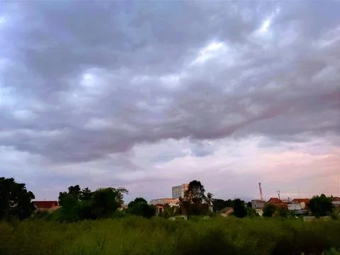 Thick black clouds in the sky before it rains Stock Photos