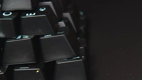 The thick black mechanical keyboard key black surface rotates 360 degrees Stock Footage 250975947