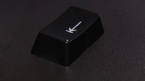 The thick black mechanical keyboard key black surface rotates 360 degrees Stock Footage 250976309