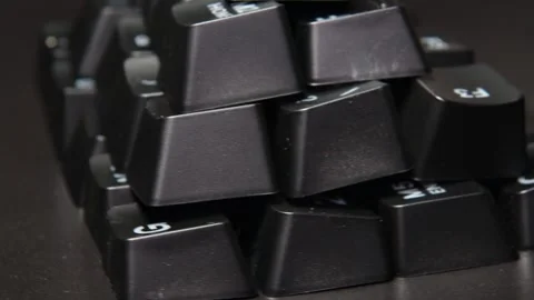The thick black mechanical keyboard key black surface rotates 360 degrees Stock Footage 250976427