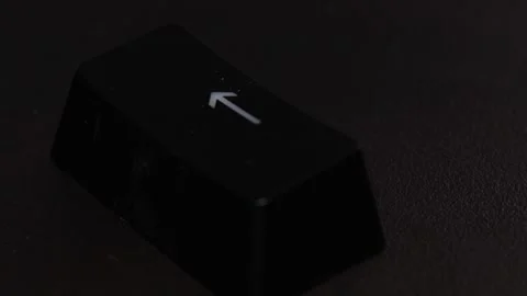 The thick black mechanical keyboard key black surface rotates 360 degrees Stock Footage 250976584