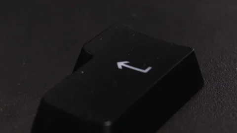 The thick black mechanical keyboard key black surface rotates 360 degrees Stock Footage 250976927