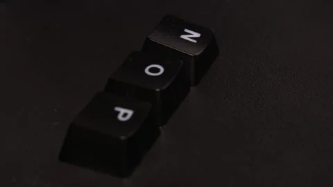 The thick black mechanical keyboard key black surface rotates 360 degrees Stock Footage 250978643