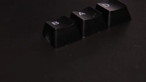 The thick black mechanical keyboard key black surface rotates 360 degrees Stock Footage 250980219