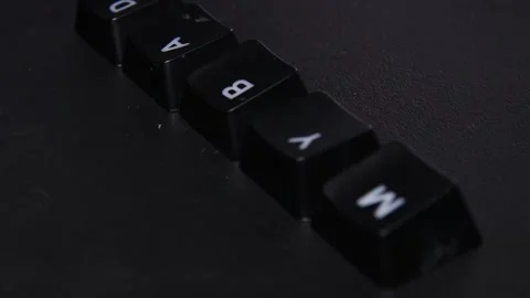 The thick black mechanical keyboard key black surface rotates 360 degrees Stock Footage 250980269
