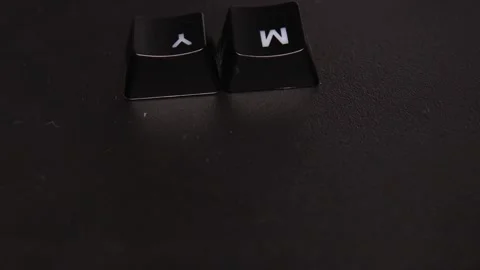 The thick black mechanical keyboard key black surface rotates 360 degrees Stock Footage 250980645